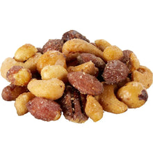 Heap of honey roasted nuts with caramelized coatings in varied shapes