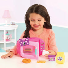 Pink Minnie microwave playset with pretend food pieces and cups, child playing