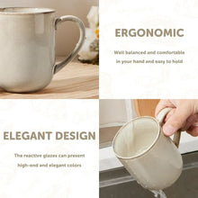 Cream ceramic coffee mug with handle, close-up view