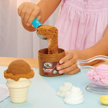 Pretend ice cream kit container with brown mix being poured into an orange tub