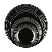 Black round bowl with concentric ridges and glossy finish