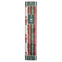 Three holiday wrapping paper rolls with nutcracker, script, plaid, and poinsettia patterns