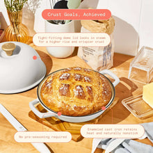 Enamel cast iron bread oven, white, featuring baked loaf in round pot