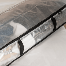 Clear storage bag side with black handle strap and zipper track