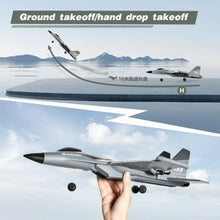 Grey RC jet aircraft showing ground takeoff or hand drop takeoff with base