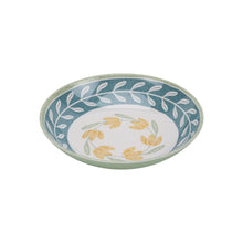 Green dinner bowl with blue rim wreath and yellow botanical motif