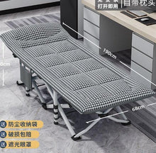 Portable folding camping cot with black-and-white checkered cushion pad and steel frame