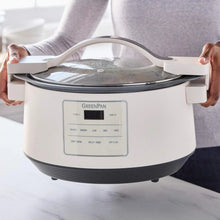 GreenPan 8-quart slow cooker with locking lid held open, showing steaming interior.