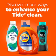 Tide Ultra Hygienic Clean detergent bottle with other laundry product bottles
