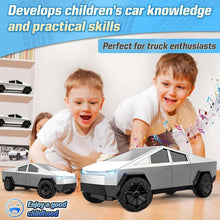 RC pickup truck with LED light bar beside two smiling boys, gray body and black wheels.