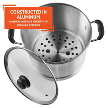 Aluminum steamer insert with perforated base inside stock pot, with glass lid