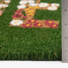 Outdoor coir doormat with floral “HELLO” on green base, shown with height up to 4 in