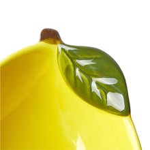 Yellow ceramic lemon bowl with green leaf and glossy glaze detail
