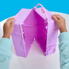 Purple doll wardrobe playset case being opened by hands