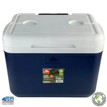 Hard-sided cooler with white top and dark navy body, front label and molded handles