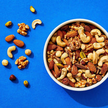 Bowl of raw mixed nuts with almonds, cashews, walnuts, and pistachios