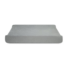 Grey contoured changing pad with plush cover, rounded edges