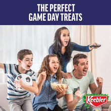 Family holding Keebler cookies with M&M’s candy pieces as snack