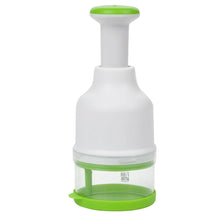 Food chopper with white body and green base, clear bowl for ingredients