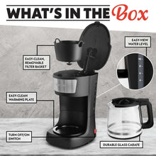 Black coffee maker unboxed view with carafe, filter basket, and warming plate