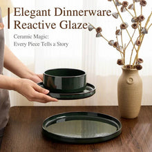 Ceramic dinnerware set with dark green serving bowl and matching plate