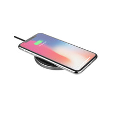 Wireless charging pad with smartphone charging on the dark charging surface