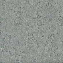 Grey changing pad cover fabric with embossed bear character pattern