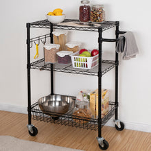 Black 3-tier wire rolling cart with wire shelves holding kitchen supplies and fruit, side handle