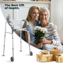 Silver walker with wheels next to seated seniors holding a bouquet