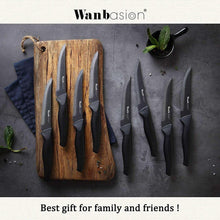 8-piece steak knife set with black handles and serrated blades