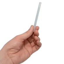 Glue stick with light gray shaft held in hand