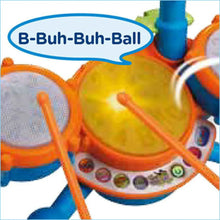 Close-up kids drum set with yellow center drum, orange rim, and side pads