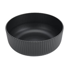 Black ribbed plastic cereal bowl with wide rim, top view