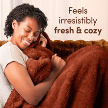 Downy Cozy Chai Latte scent lifestyle scene, woman hugging plush blanket