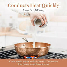 Copper hammered nonstick frying pan on a stovetop, pouring liquid into pan