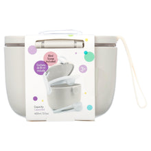 White formula storage container with scoop and measuring cup accessory