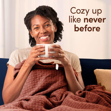 Downy Cozy Chai Latte scent lifestyle scene, woman smiling with a mug