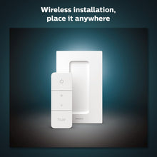 White Philips Hue dimmer switch and wall mount bracket, three control buttons