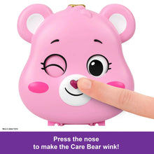 Pink bear-face doll toy with smiling face and raised nose wink