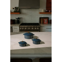 Atlantic blue ceramic casserole set with three covered pots and gold knob lids