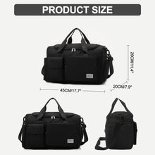 Black quilted duffel bag shown with top handle and adjustable shoulder strap