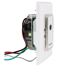 White wall switch module with exposed wiring and snap-on remote with black button.