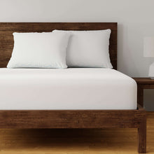 Two white pillows on a bed for back and side sleeping