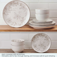 Stoneware dinnerware set with floral salad plates, stacked dinner plates, and bowls
