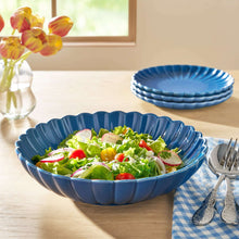Blue stoneware serving bowl filled with salad