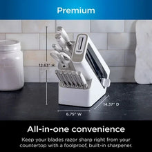 White built-in knife sharpener block holding stainless steel knives
