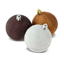 Assorted shatterproof Christmas ball ornaments: dark brown, white, and bronze with gold caps