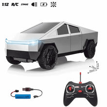 RC pickup truck with glowing LED light bar and rugged black wheels, gray body.
