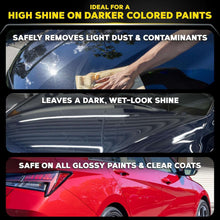 Detailer spray and microfiber wiping on dark car paint for a wet-look shine