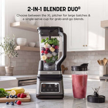 Stainless blender with clear pitcher, lid, blade column, and single-serve grab cup